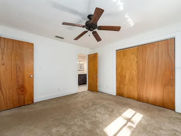 a view of an empty room and a window