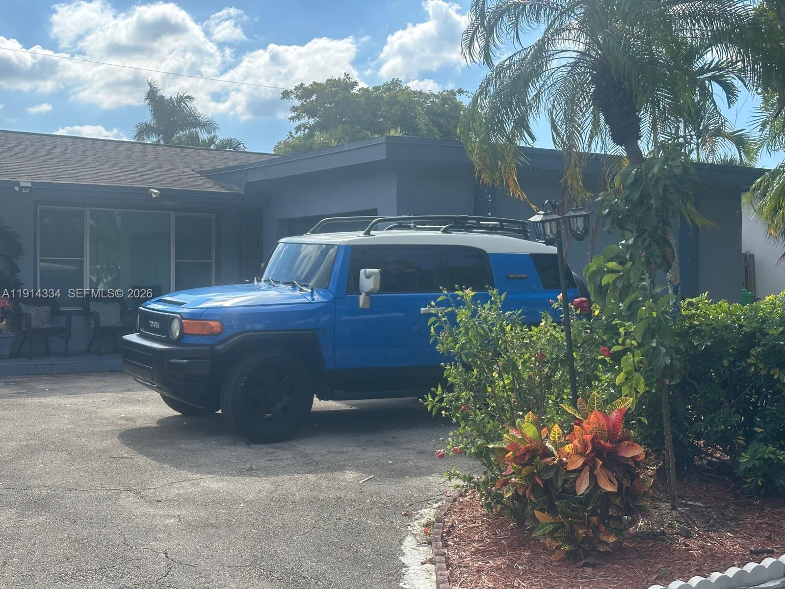 9530 Sunset Strip Sunrise, FL 33322 - Photo 2 of 11 a view of a patio with table and chairs potted plants