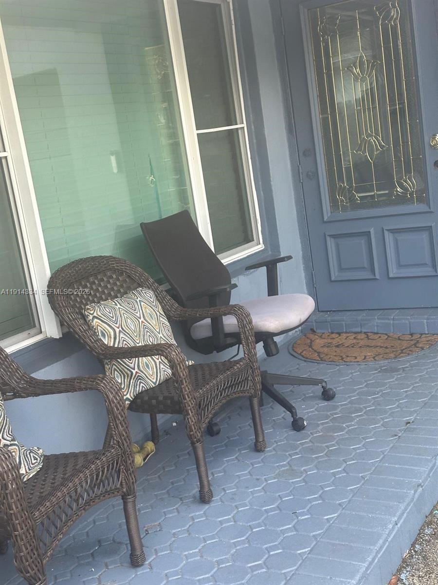 9530 Sunset Strip Sunrise, FL 33322 - Photo 10 of 11 a living room with furniture and a window