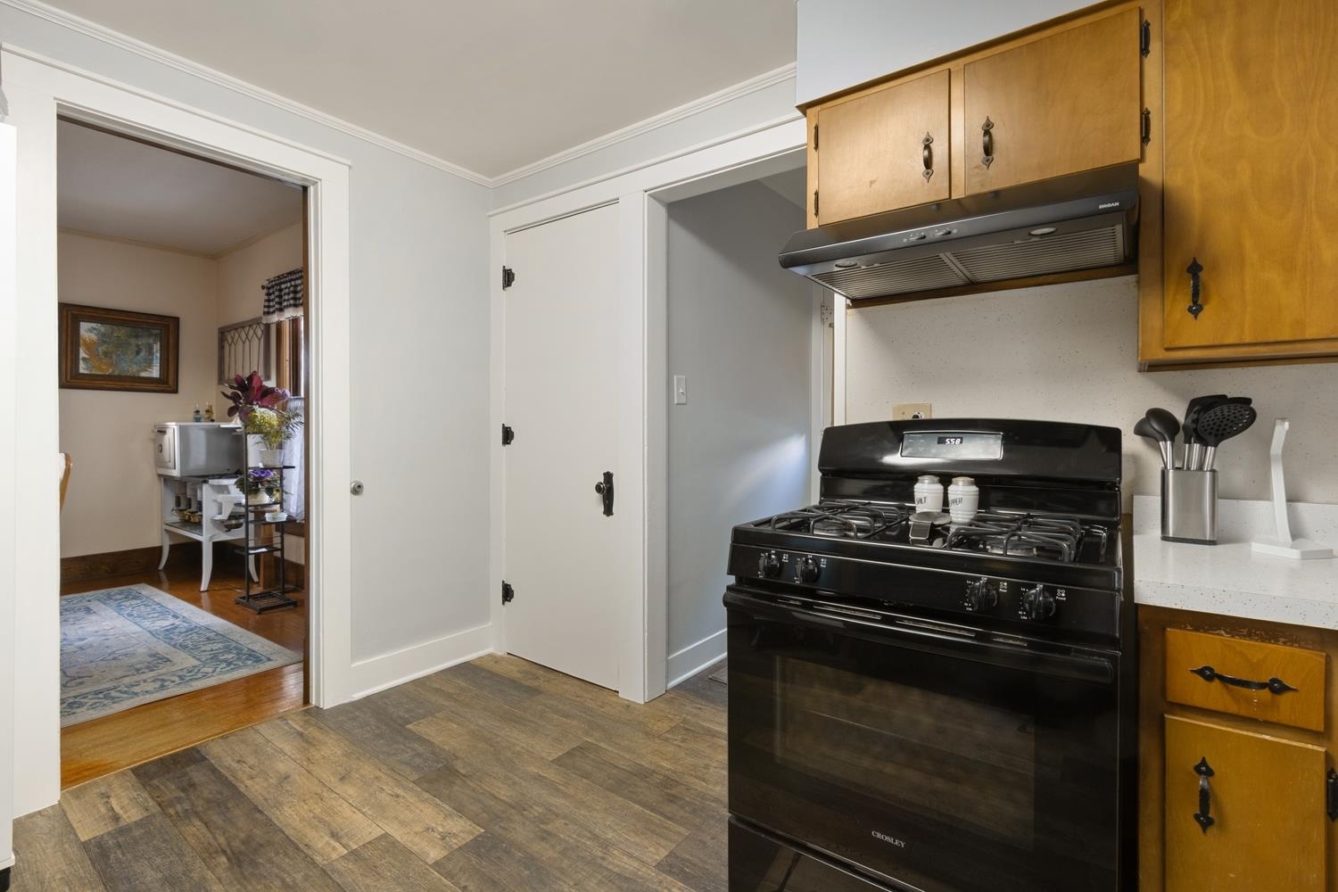 804 Locust Street Sterling, IL 61081 - Photo 13 of 25 a kitchen with a stove and a cabinet