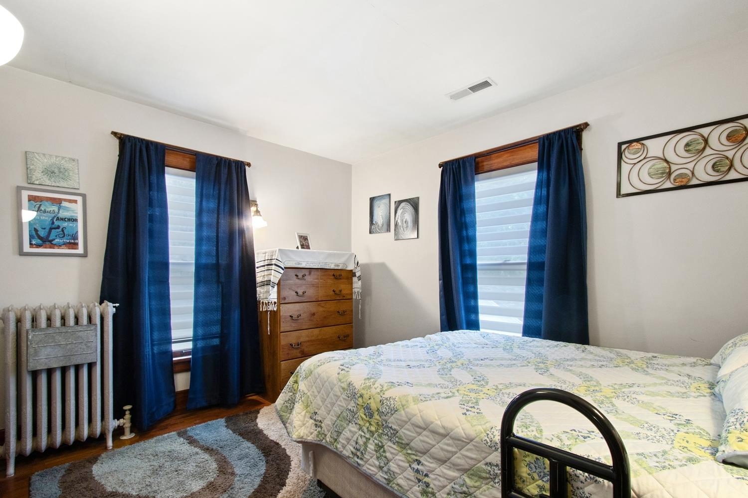 804 Locust Street Sterling, IL 61081 - Photo 18 of 25 a bedroom with a bed and a dresser
