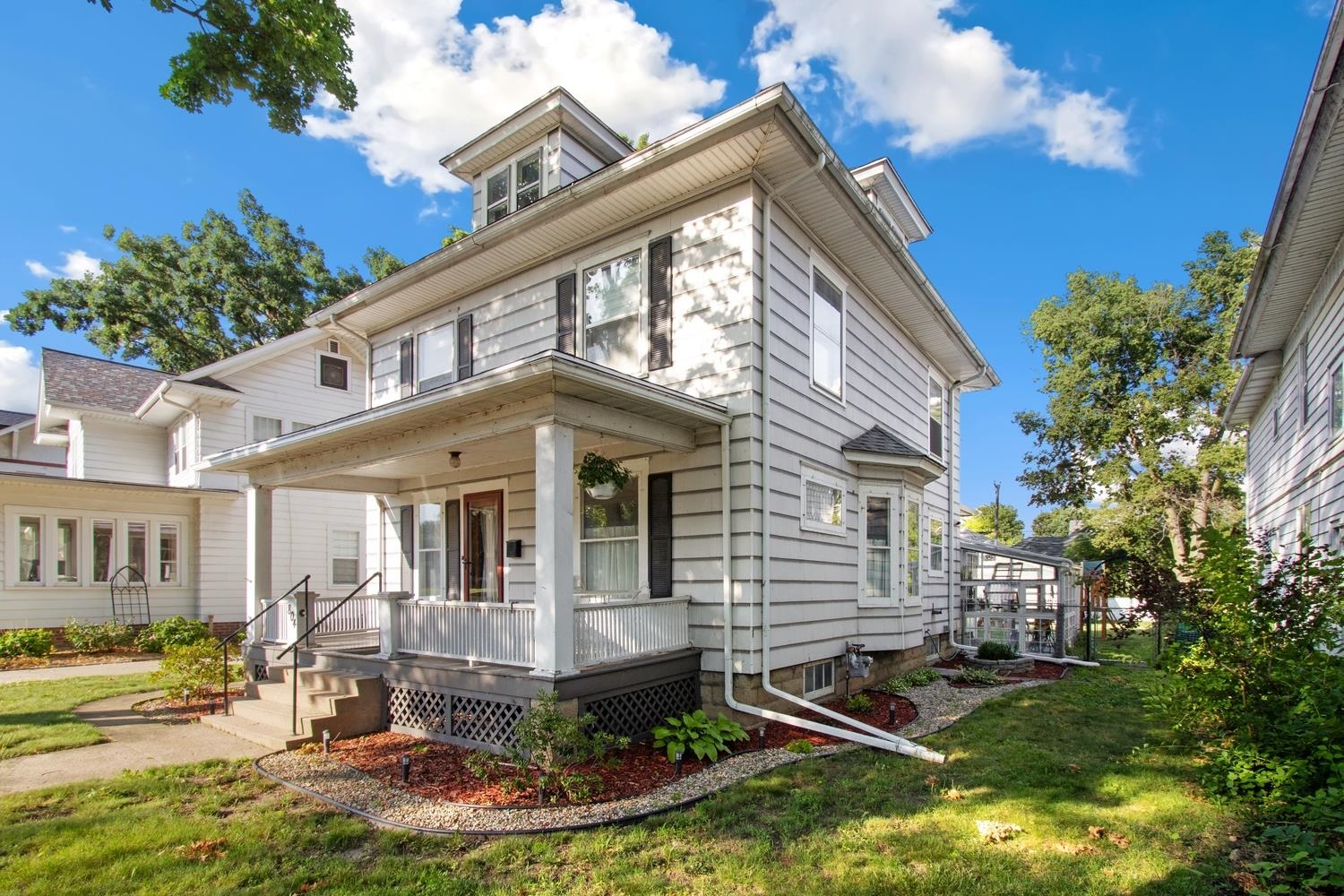 804 Locust Street Sterling, IL 61081 - Photo 2 of 25 a front view of a house with a yard