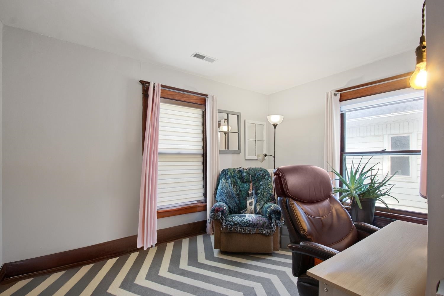 804 Locust Street Sterling, IL 61081 - Photo 21 of 25 a living room with furniture and a potted plant