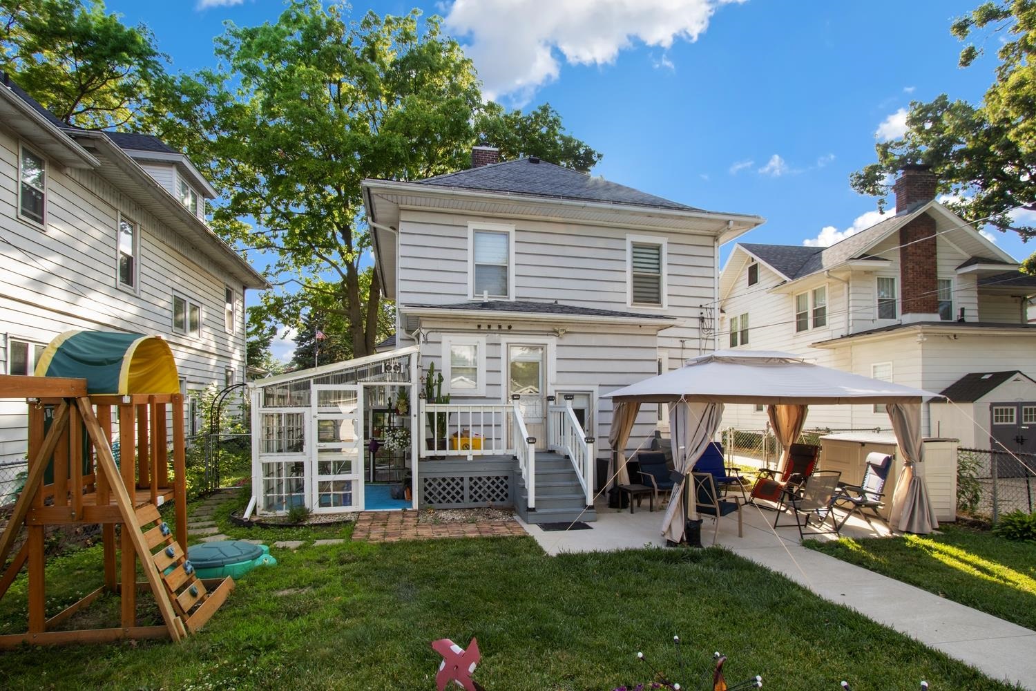 804 Locust Street Sterling, IL 61081 - Photo 4 of 25 a view of a house with a yard and sitting area
