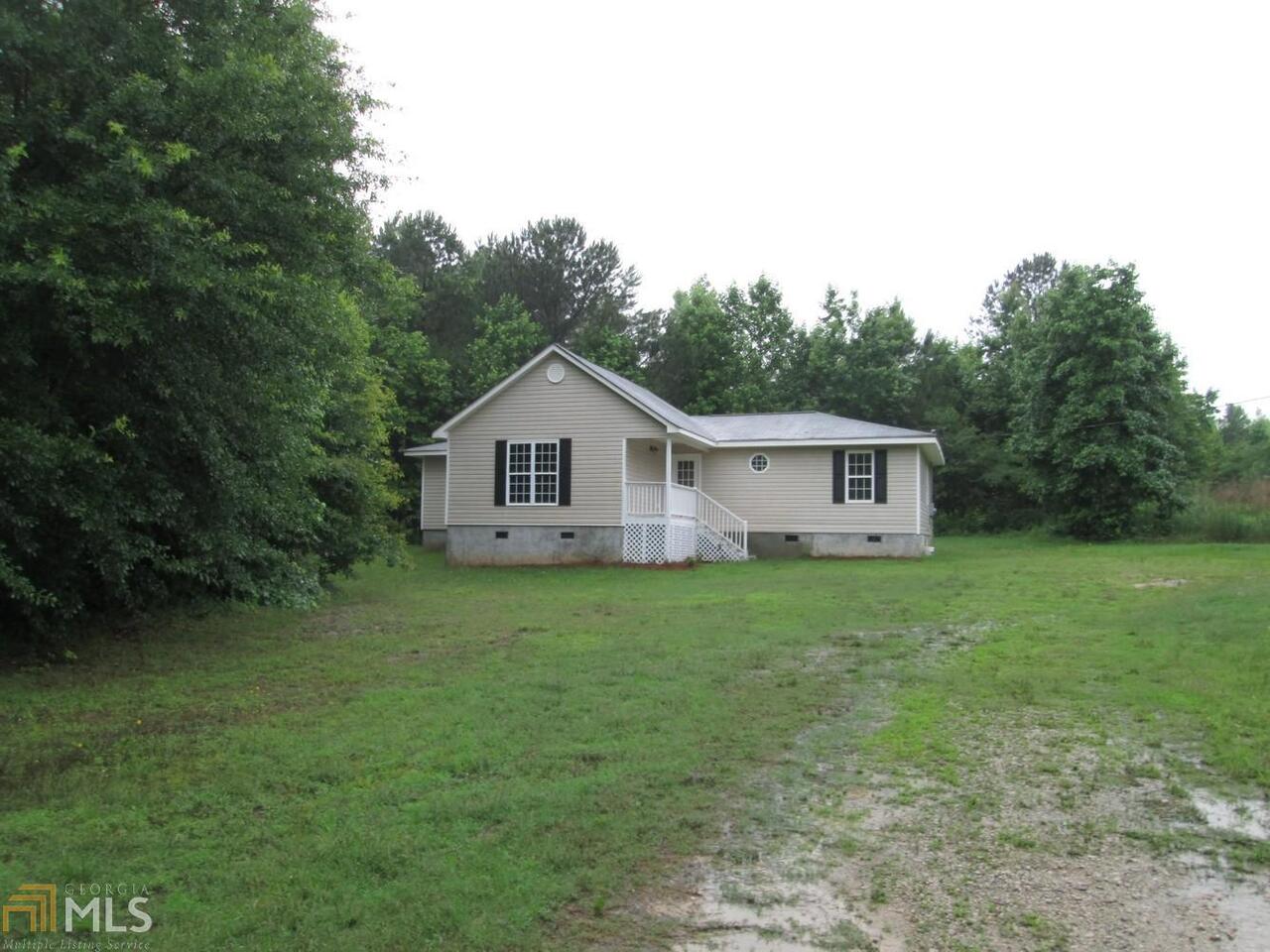 1121 Fincherville Road Jackson, GA 30233 - Photo 1 of 1 a front view of a house with garden