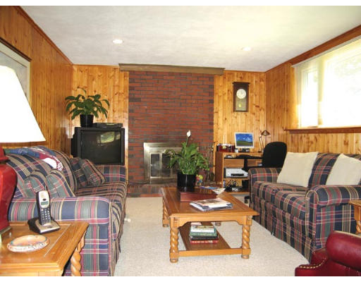 19 Sherrin Road Newton, MA 02462 - Photo 3 of 7 a living room with furniture fireplace and a large window