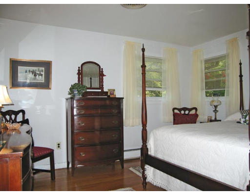 19 Sherrin Road Newton, MA 02462 - Photo 6 of 7 a bedroom with a bed and a dresser next to a window
