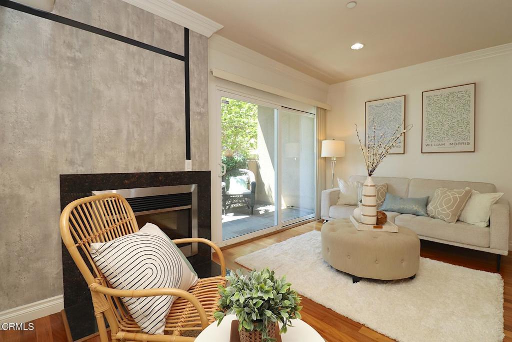 3855 Ingraham Street, Unit 204 Los Angeles, CA 90005 - Photo 11 of 35 a living room with furniture and a fireplace