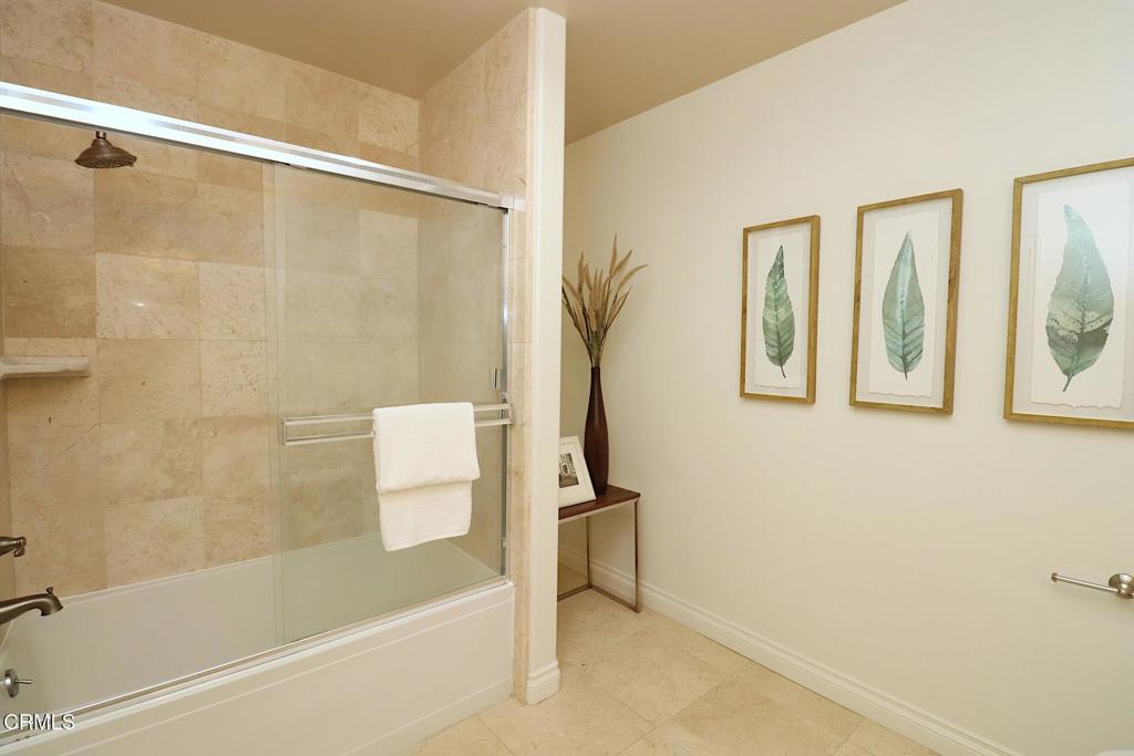 3855 Ingraham Street, Unit 204 Los Angeles, CA 90005 - Photo 20 of 35 a bathroom with a bathtub and a shower
