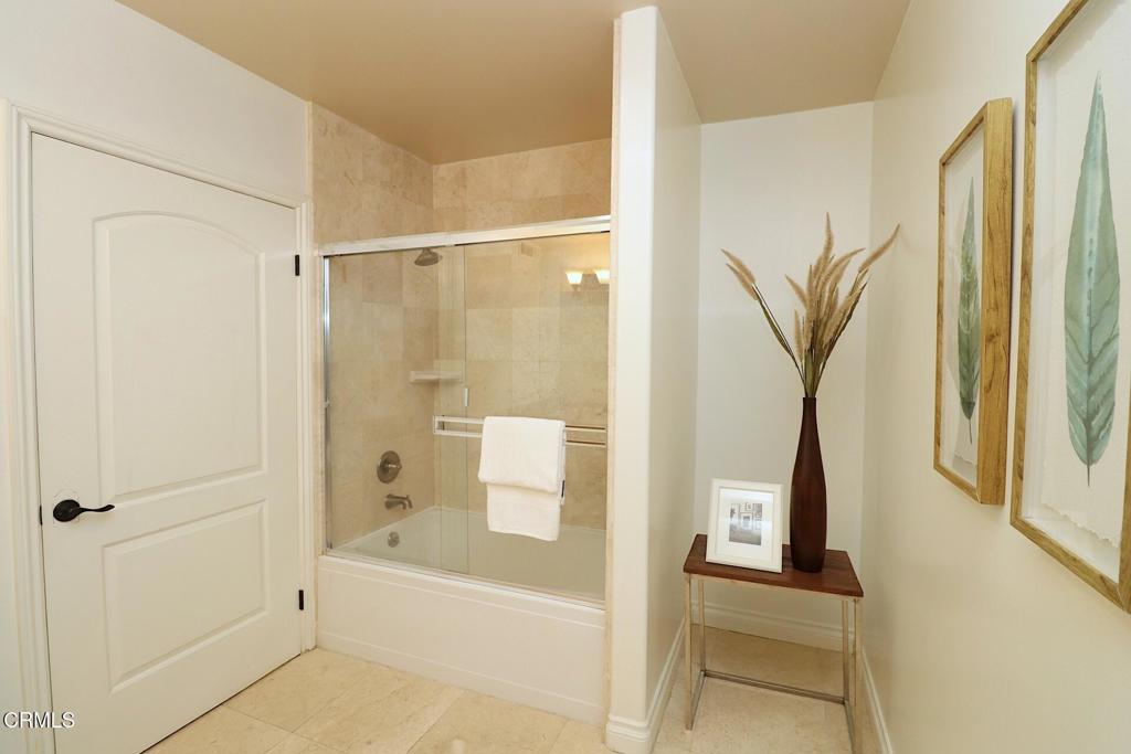 3855 Ingraham Street, Unit 204 Los Angeles, CA 90005 - Photo 21 of 35 a bathroom with a bathtub and a shower