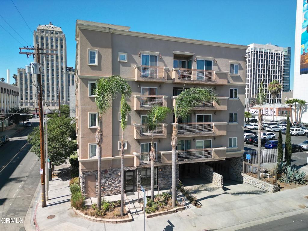 3855 Ingraham Street, Unit 204 Los Angeles, CA 90005 - Photo 33 of 35 a front view of a building with glass windows