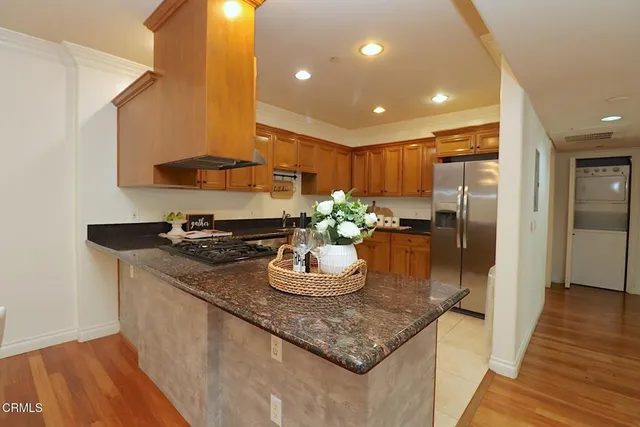a kitchen with a sink and stove