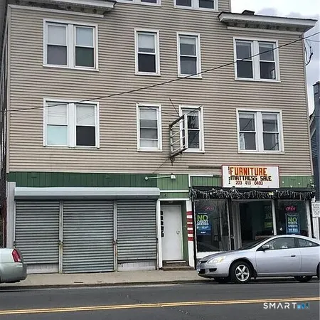 a view of a car parked in front of a building