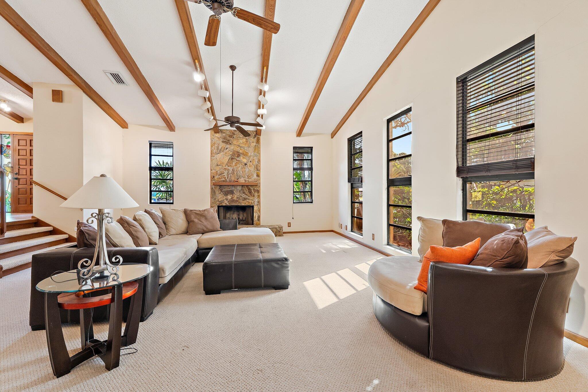 702 Warren Drive Jupiter, FL 33458 - Photo 36 of 76 a living room with furniture and a large window