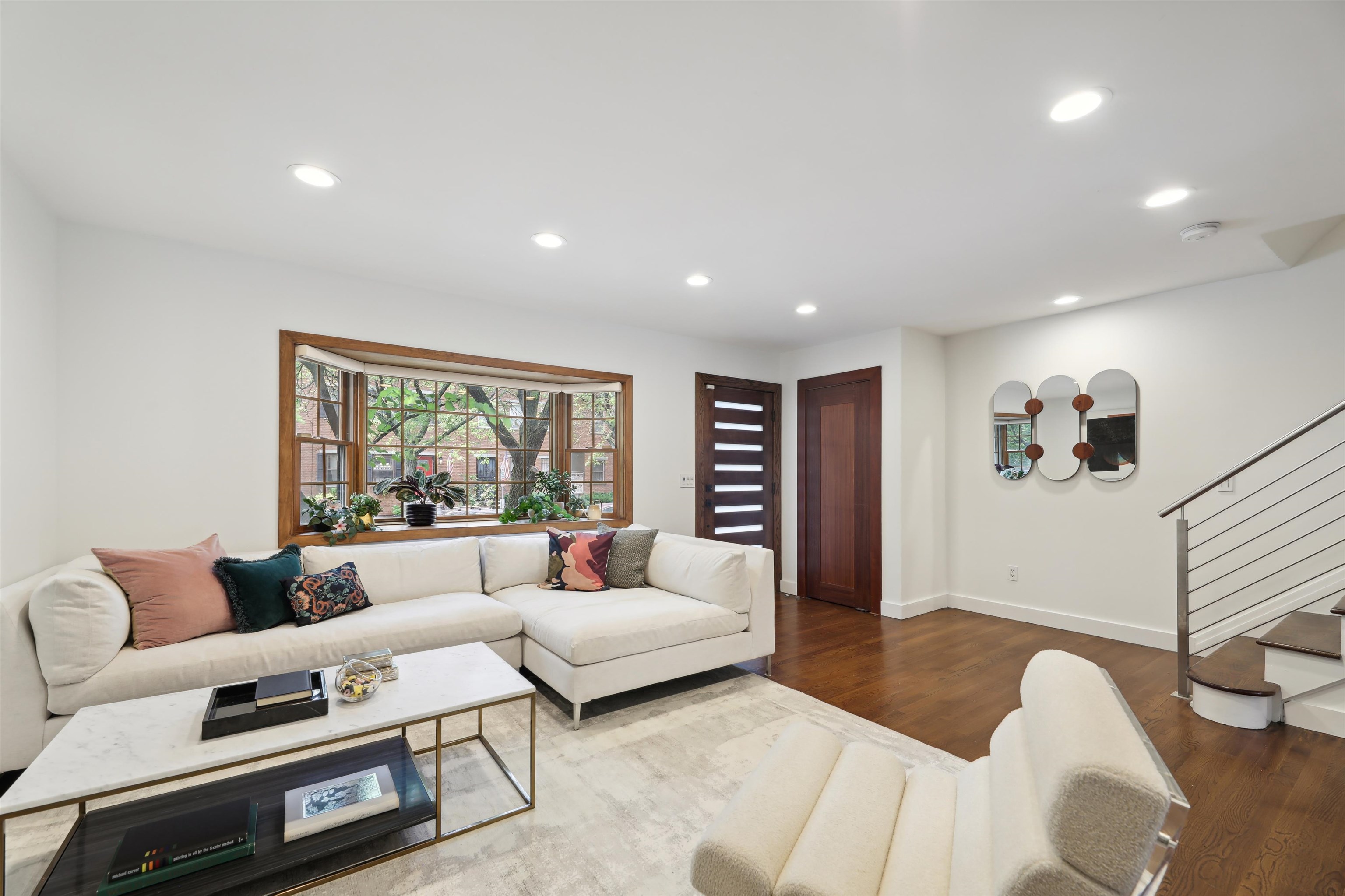 310 9th Street Jersey City, NJ 07302 - Photo 2 of 34 a living room with furniture and a large window