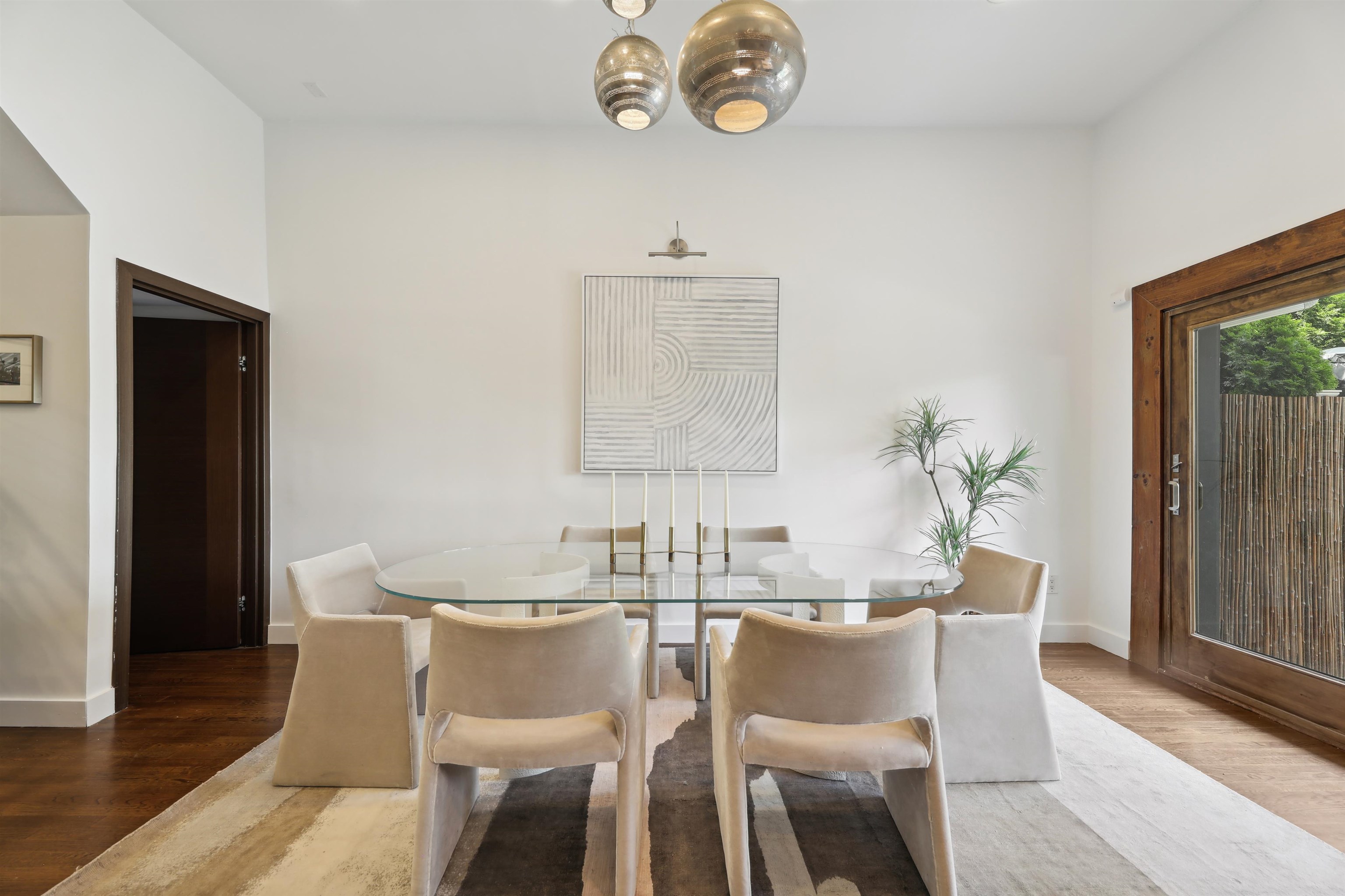 310 9th Street Jersey City, NJ 07302 - Photo 7 of 34 a dining room with furniture a rug and wooden floor