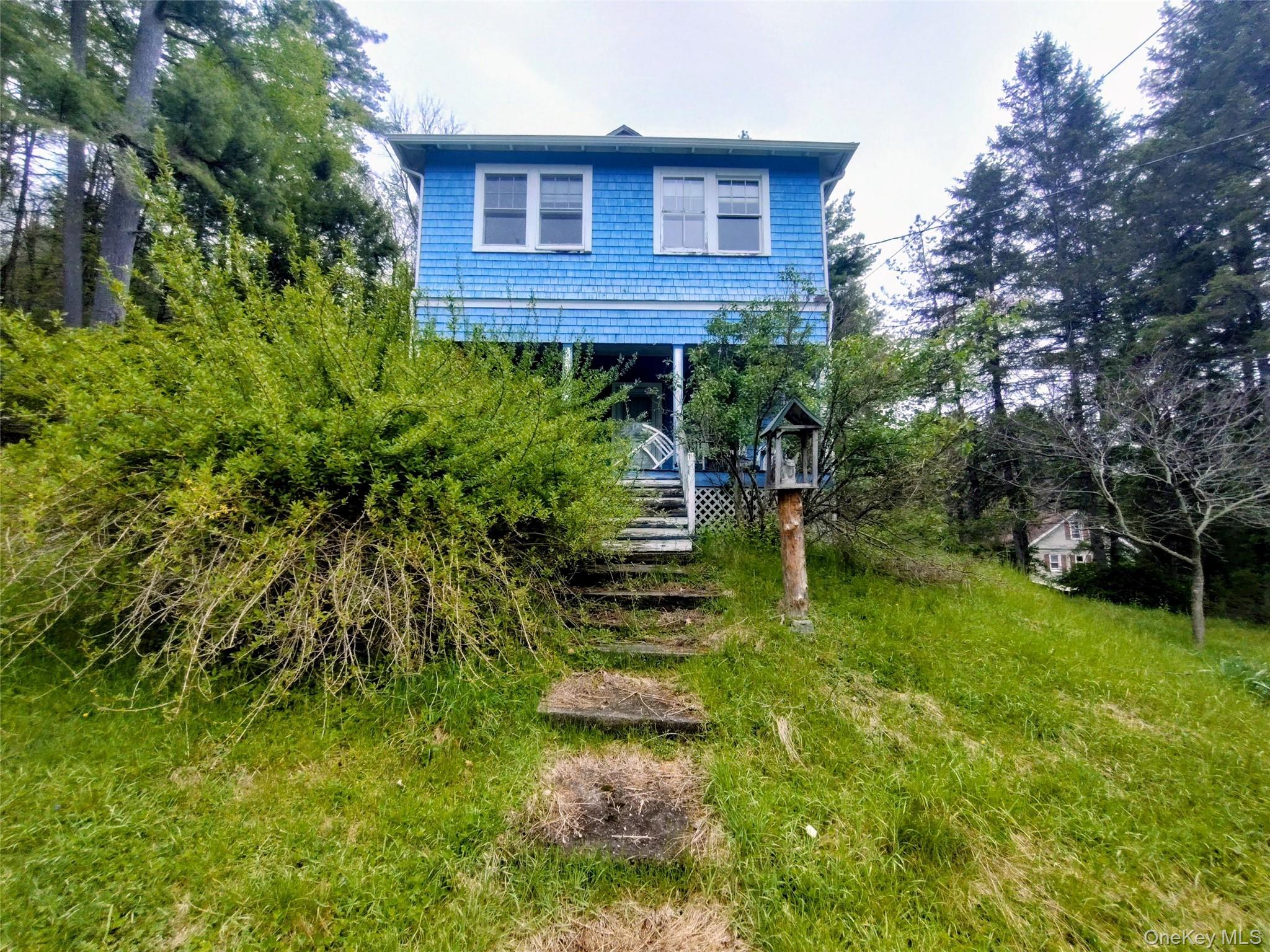 174 Forestburgh Road Forestburgh, NY 12777 - Photo 25 of 28 a view of a brick house with a yard and plants