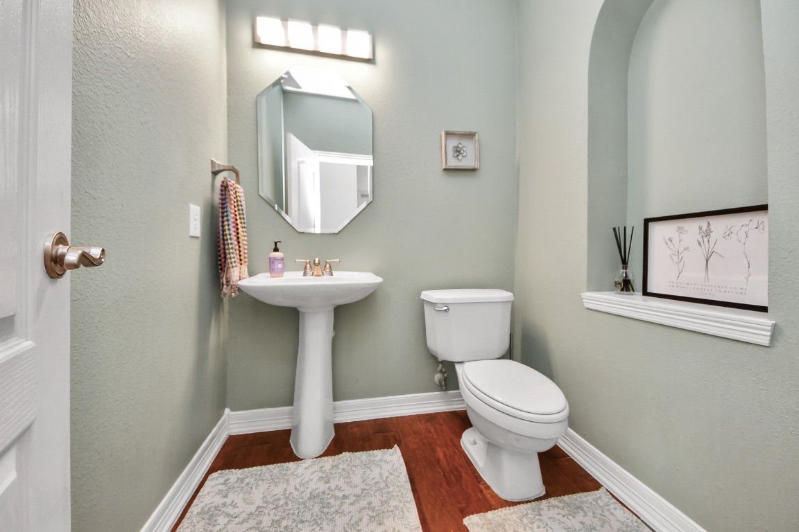 5703 Brennan Ridge Lane Katy, TX 77450 - Photo 12 of 45 a bathroom with a sink a toilet and mirror