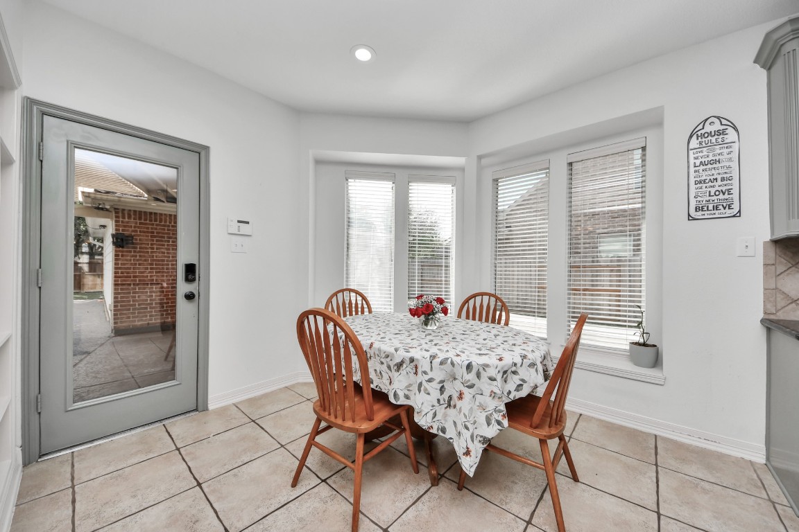 5703 Brennan Ridge Lane Katy, TX 77450 - Photo 18 of 45 a dining room with furniture and window