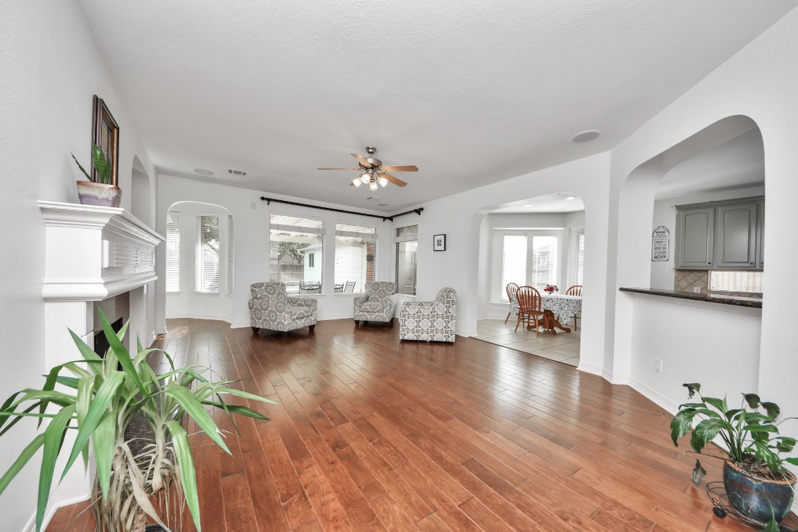 5703 Brennan Ridge Lane Katy, TX 77450 - Photo 19 of 45 a living room with furniture and a wooden floor