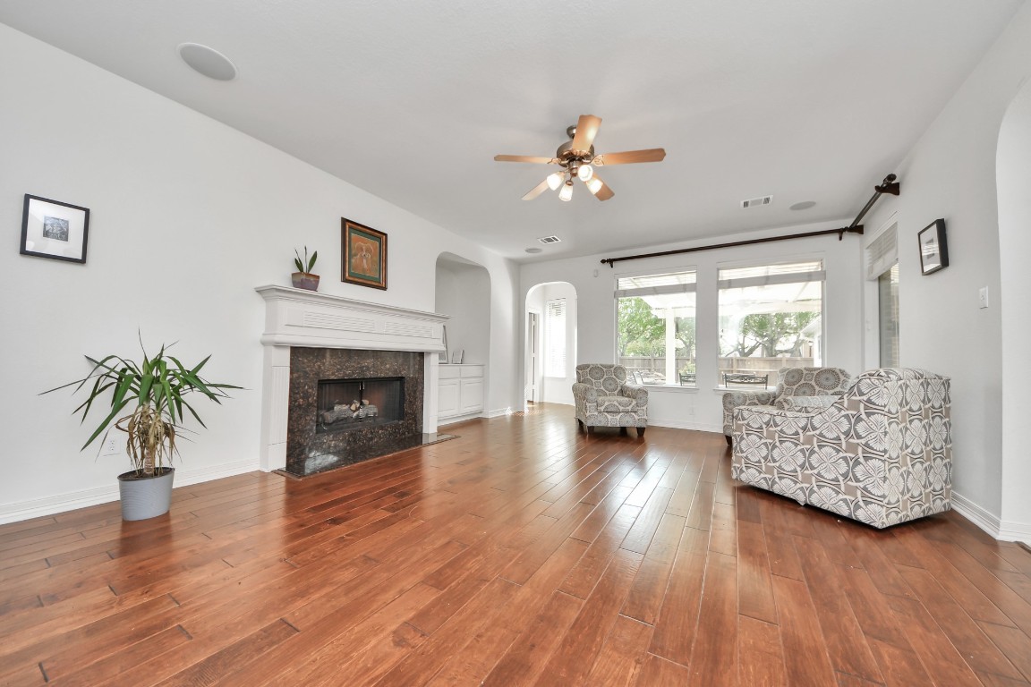 5703 Brennan Ridge Lane Katy, TX 77450 - Photo 20 of 45 a living room with furniture and a fireplace