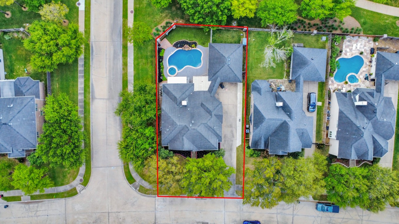 5703 Brennan Ridge Lane Katy, TX 77450 - Photo 2 of 45 an aerial view of house and yard with swimming pool