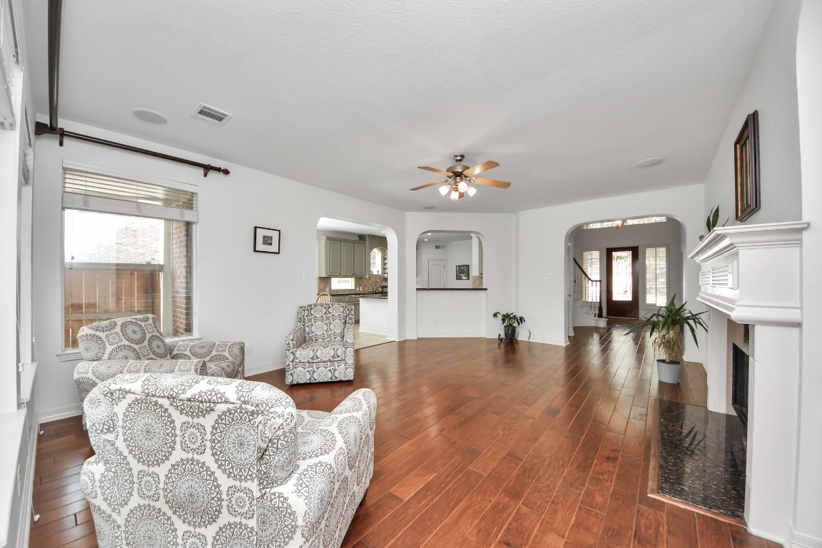 5703 Brennan Ridge Lane Katy, TX 77450 - Photo 21 of 45 a living room with furniture and a wooden floor