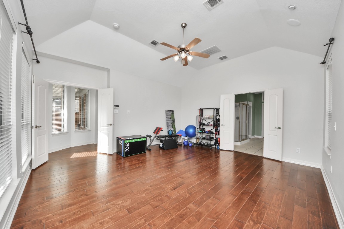 5703 Brennan Ridge Lane Katy, TX 77450 - Photo 23 of 45 a view of a livingroom with hardwood floor and a ceiling fan