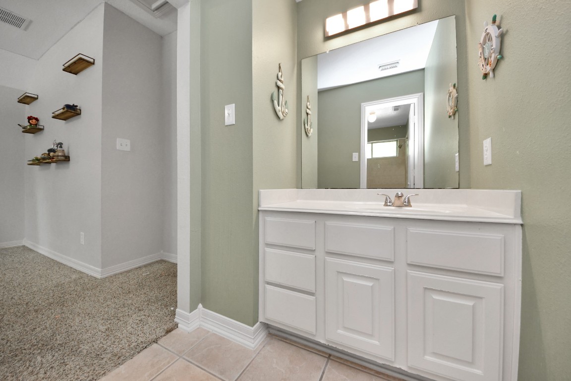 5703 Brennan Ridge Lane Katy, TX 77450 - Photo 33 of 45 a bathroom with a double vanity sink and mirror