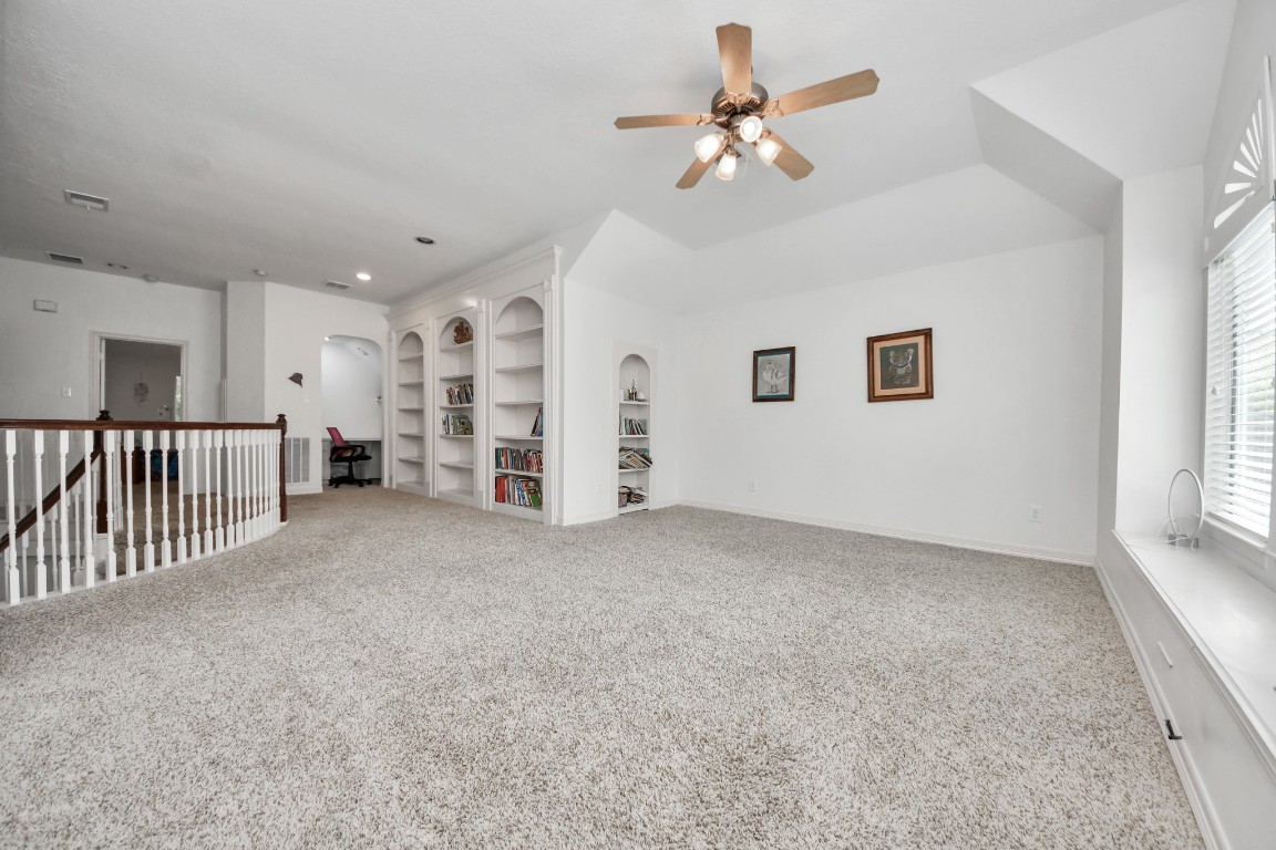 5703 Brennan Ridge Lane Katy, TX 77450 - Photo 39 of 45 a view of a livingroom with a ceiling fan and window