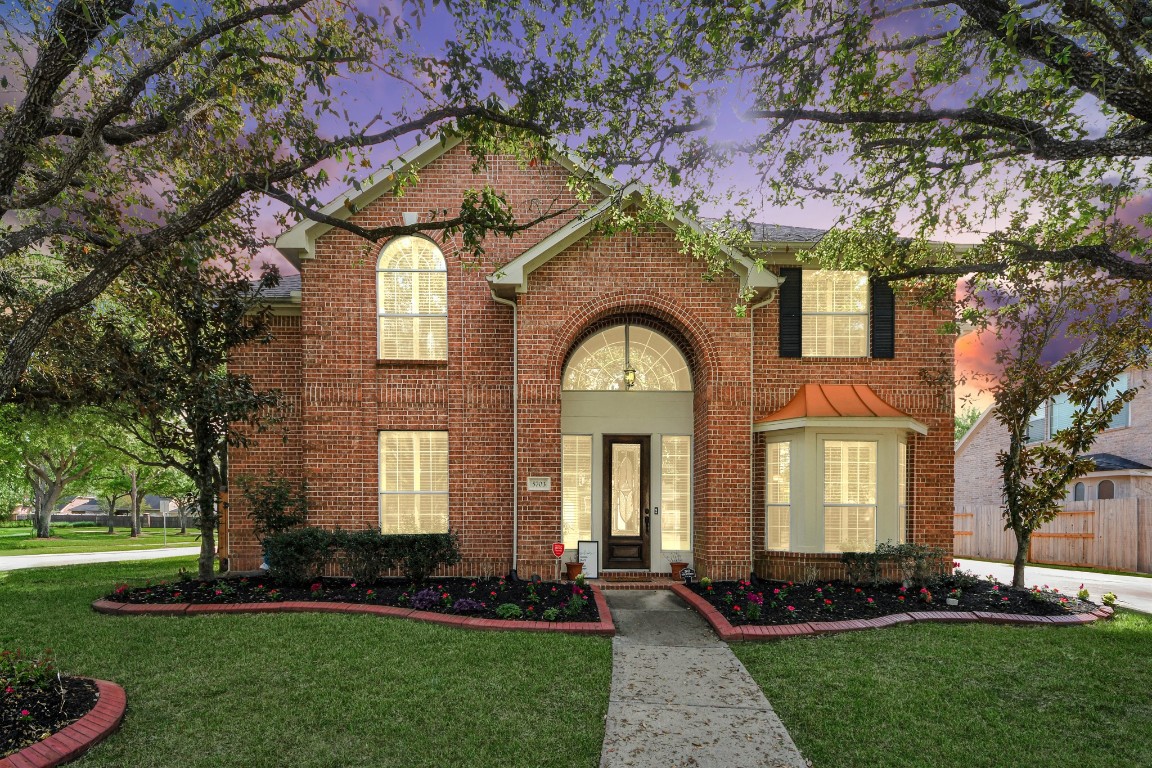 5703 Brennan Ridge Lane Katy, TX 77450 - Photo 4 of 45 a front view of a house with a yard
