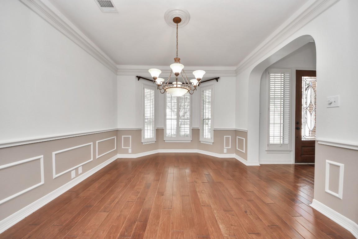 5703 Brennan Ridge Lane Katy, TX 77450 - Photo 10 of 45 a view of an empty room with wooden floor and a window
