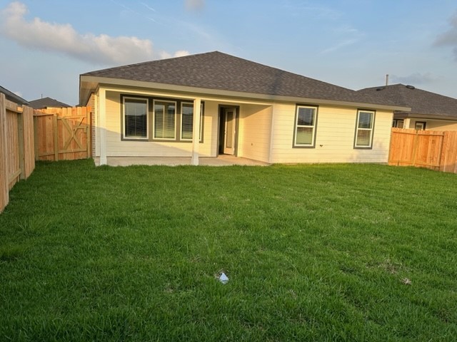 7826 Sleek Flock Lane Rosharon, TX 77583 - Photo 11 of 16 a front view of a house with a garden