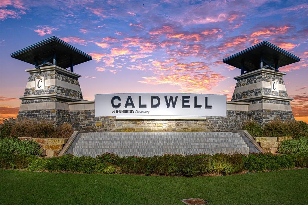 7826 Sleek Flock Lane Rosharon, TX 77583 - Photo 16 of 16 a front view of a house with a garden and deck