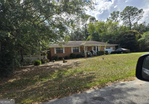 306 Midland Place Cairo, GA 39828 - Photo 1 of 1 a view of a house with a yard