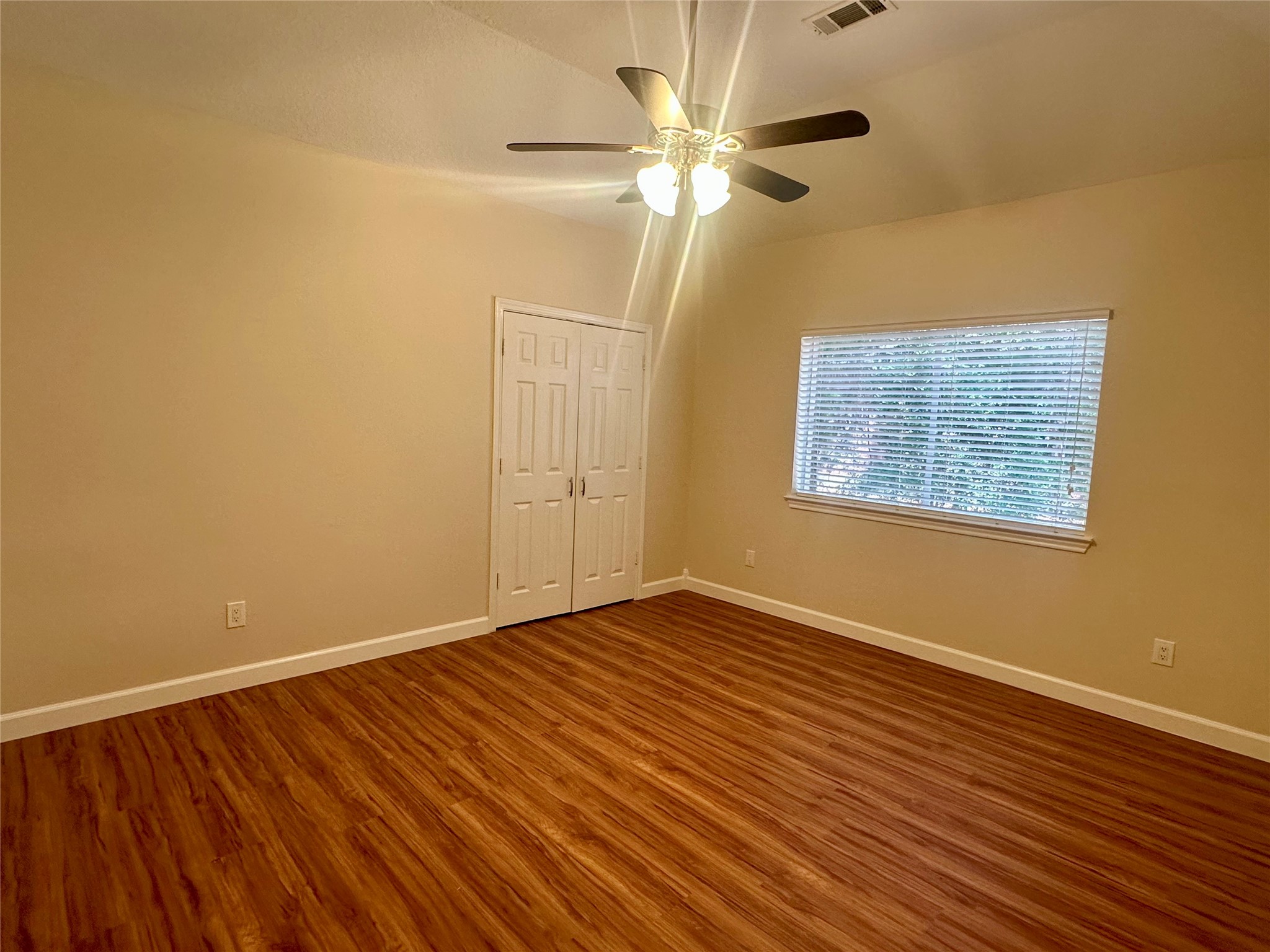 3122 Hemingway Drive Montgomery, TX 77356 - Photo 12 of 15 a view of an empty room with wooden floor and a window