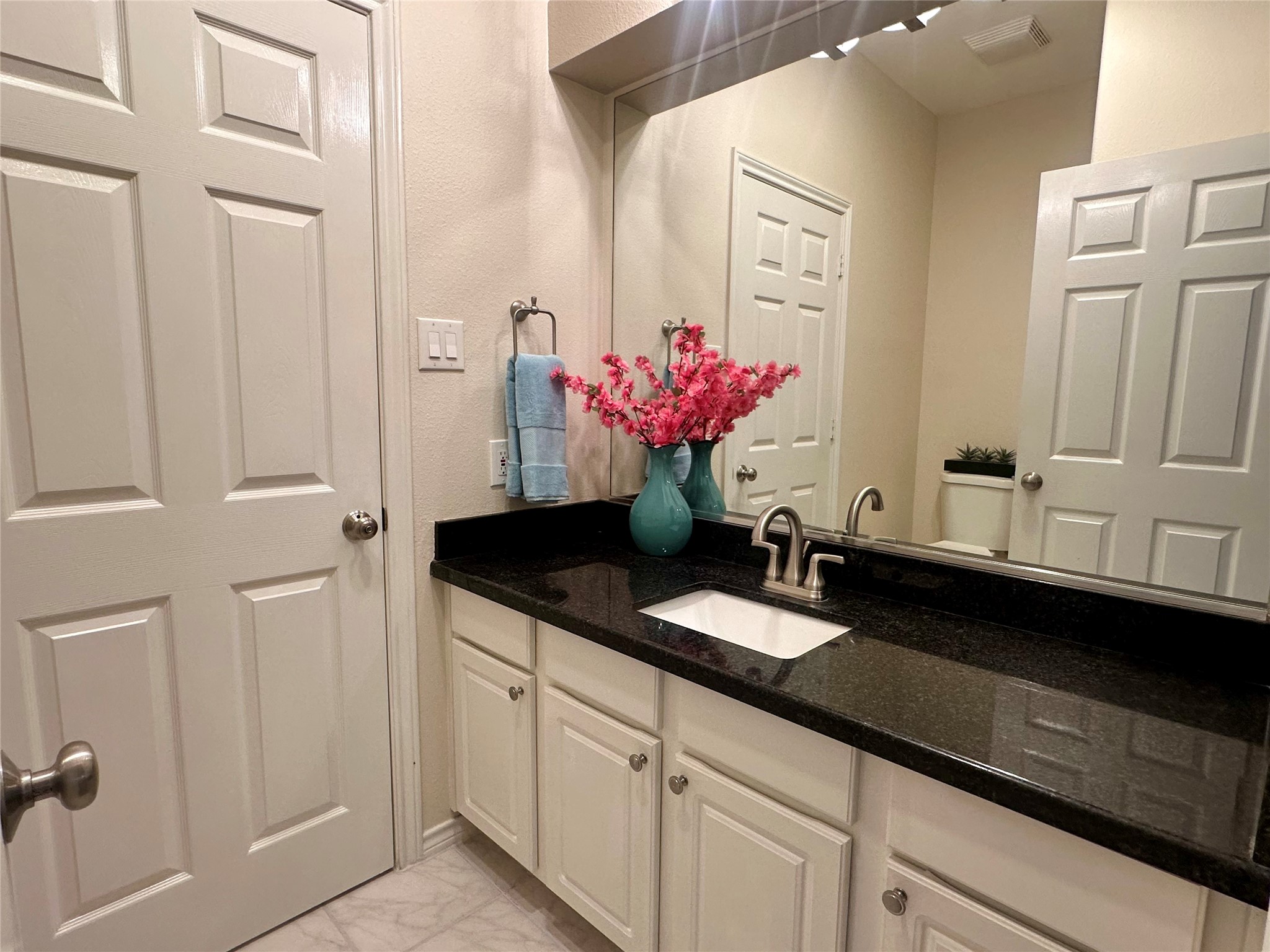 3122 Hemingway Drive Montgomery, TX 77356 - Photo 13 of 15 a bathroom with cabinets sink and a mirror