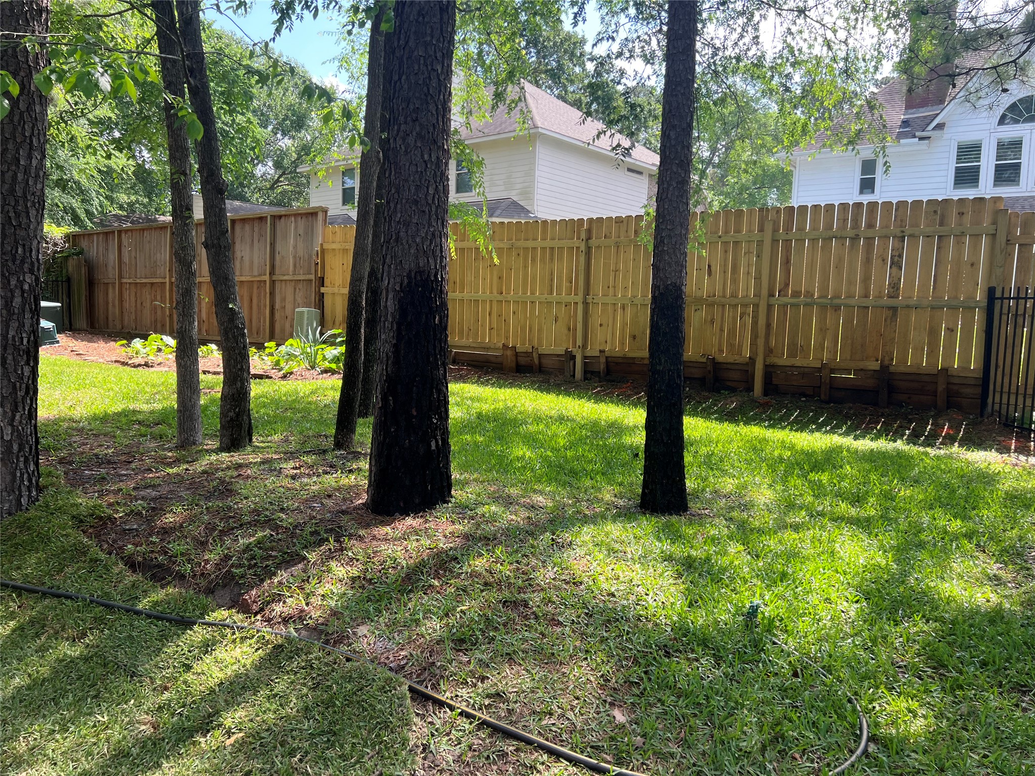 3122 Hemingway Drive Montgomery, TX 77356 - Photo 14 of 15 a backyard of a house with lots of green space