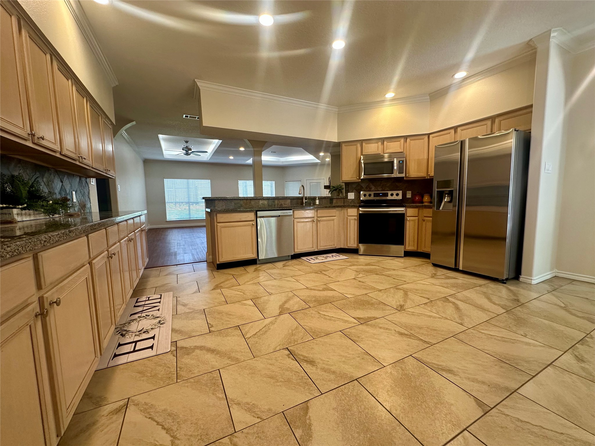 3122 Hemingway Drive Montgomery, TX 77356 - Photo 7 of 15 a large kitchen with stainless steel appliances and chandelier