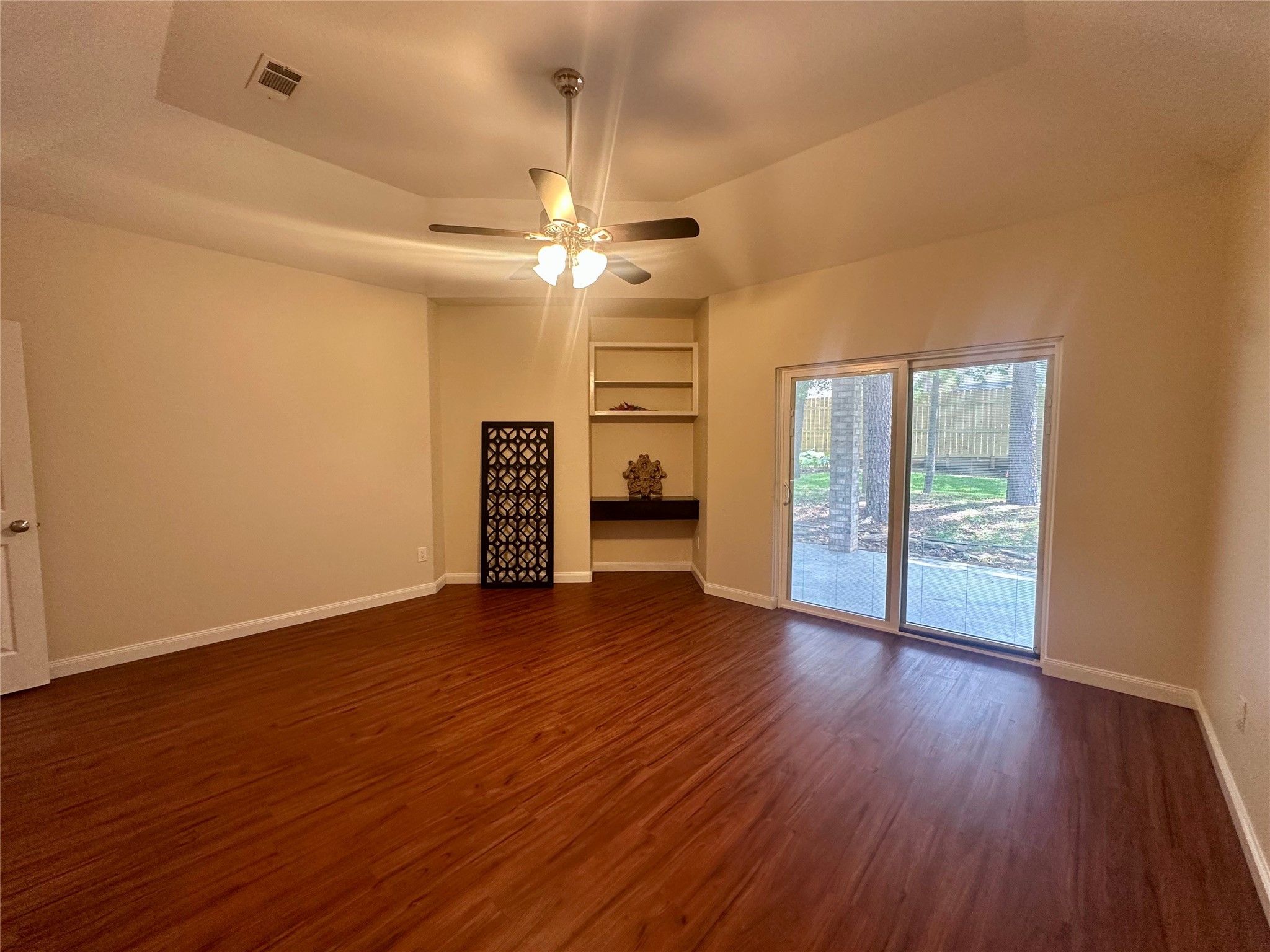 3122 Hemingway Drive Montgomery, TX 77356 - Photo 8 of 15 a view of an empty room with a window and wooden floor