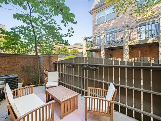 a view of a chair and table and chair and wooden floor