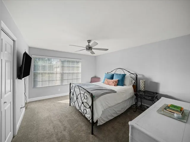 a bed room with two bed and a flat screen tv