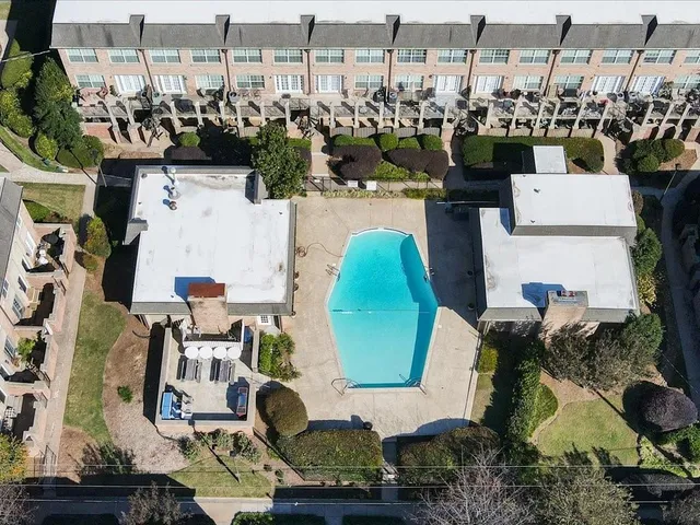 an aerial view of a house with outdoor space