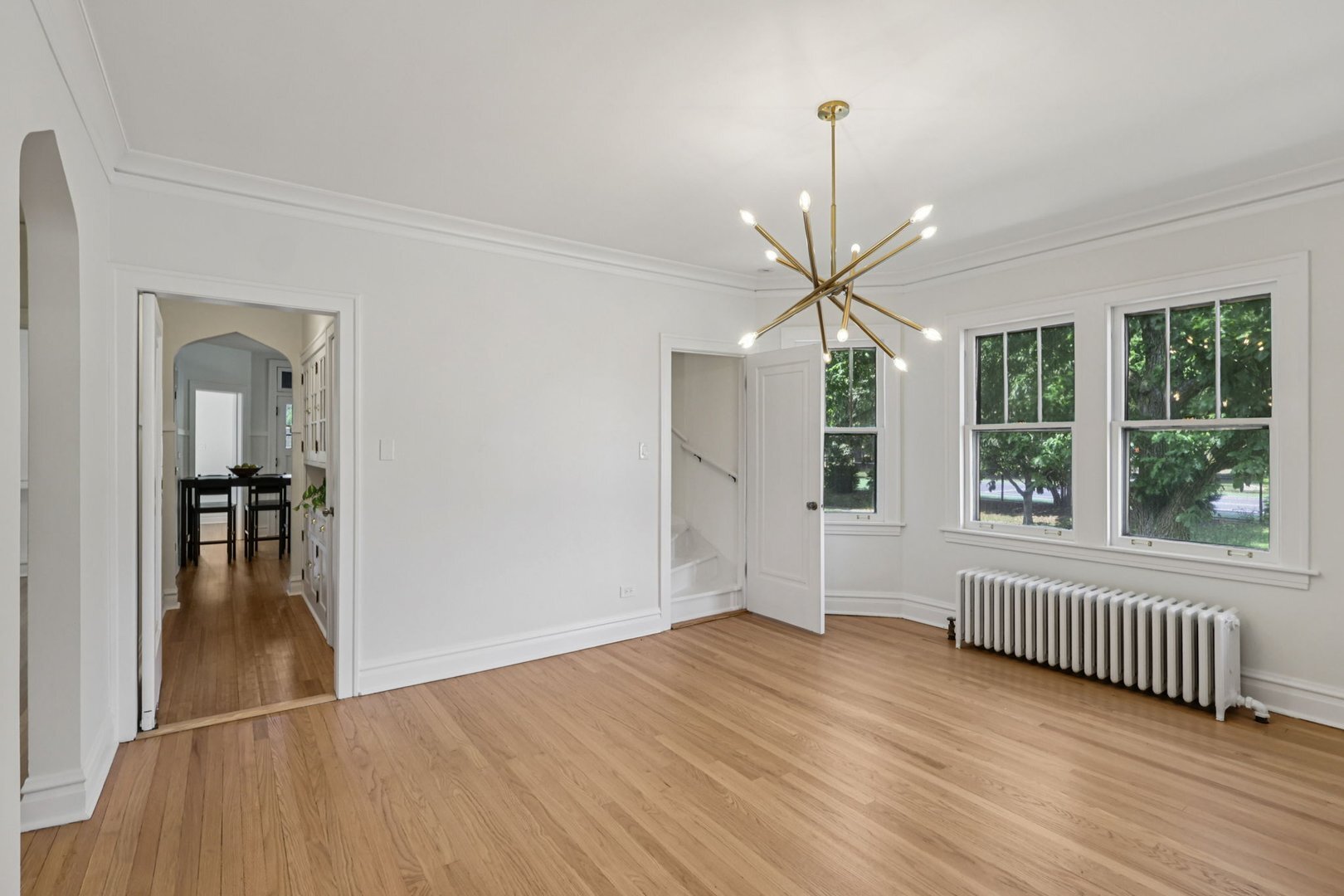 5253 Cleveland Street Skokie, IL 60077 - Photo 11 of 57 a view of empty room with wooden floor and fan