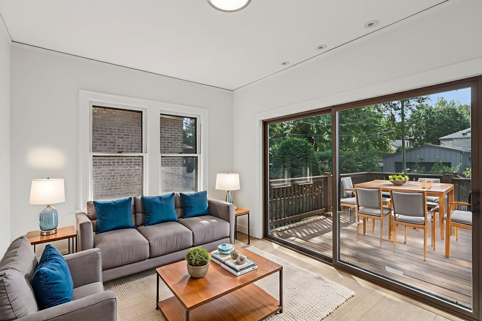 5253 Cleveland Street Skokie, IL 60077 - Photo 12 of 57 a living room with furniture and a floor to ceiling window