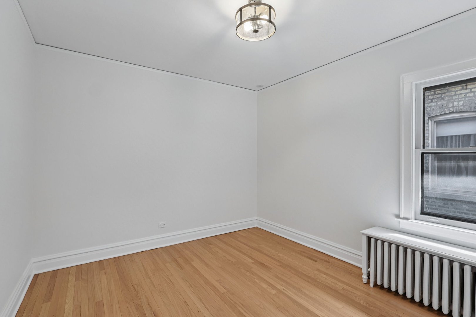 5253 Cleveland Street Skokie, IL 60077 - Photo 27 of 57 a view of a room with wooden floor and fan