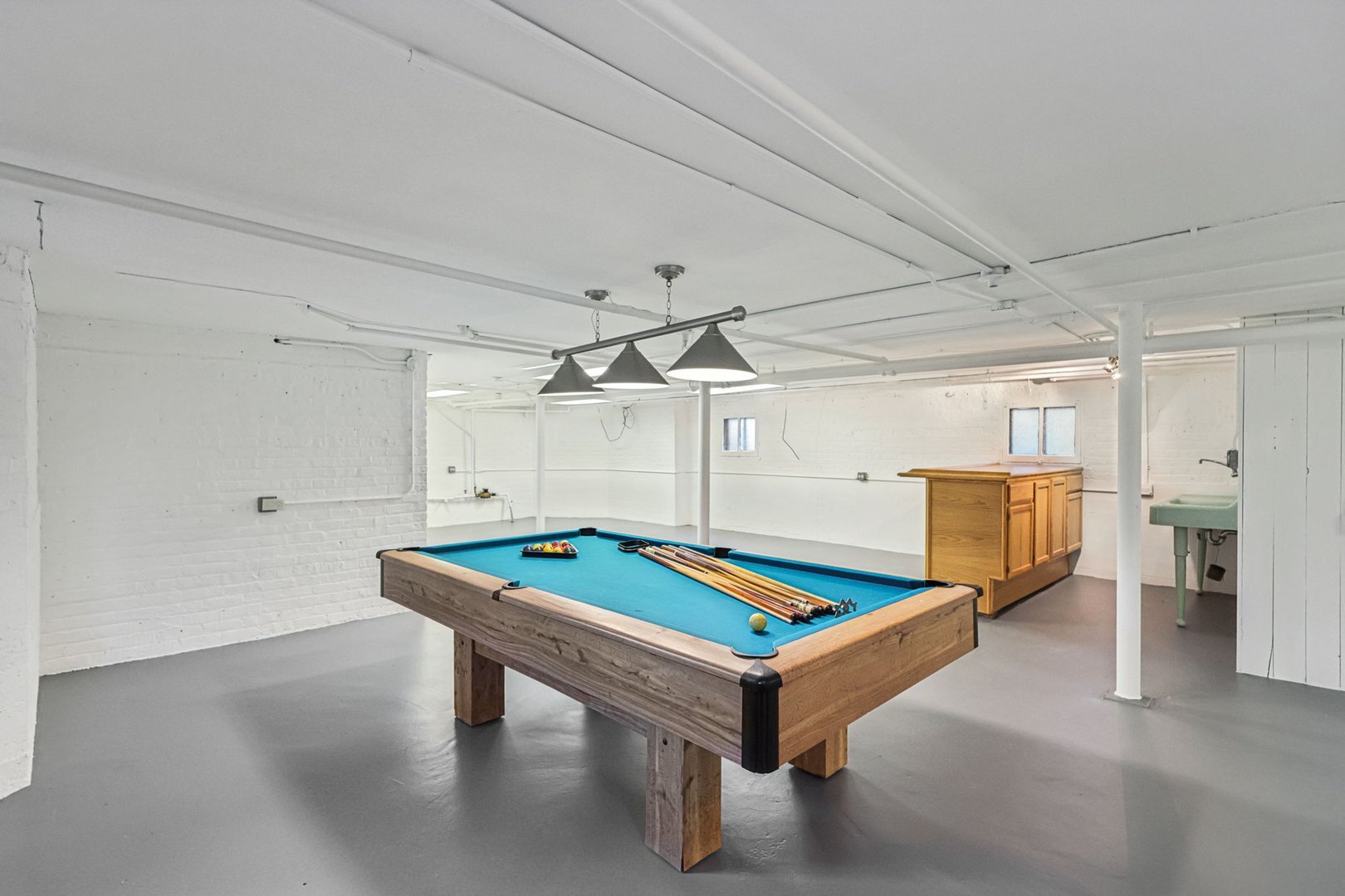5253 Cleveland Street Skokie, IL 60077 - Photo 33 of 57 a room with pool table and windows