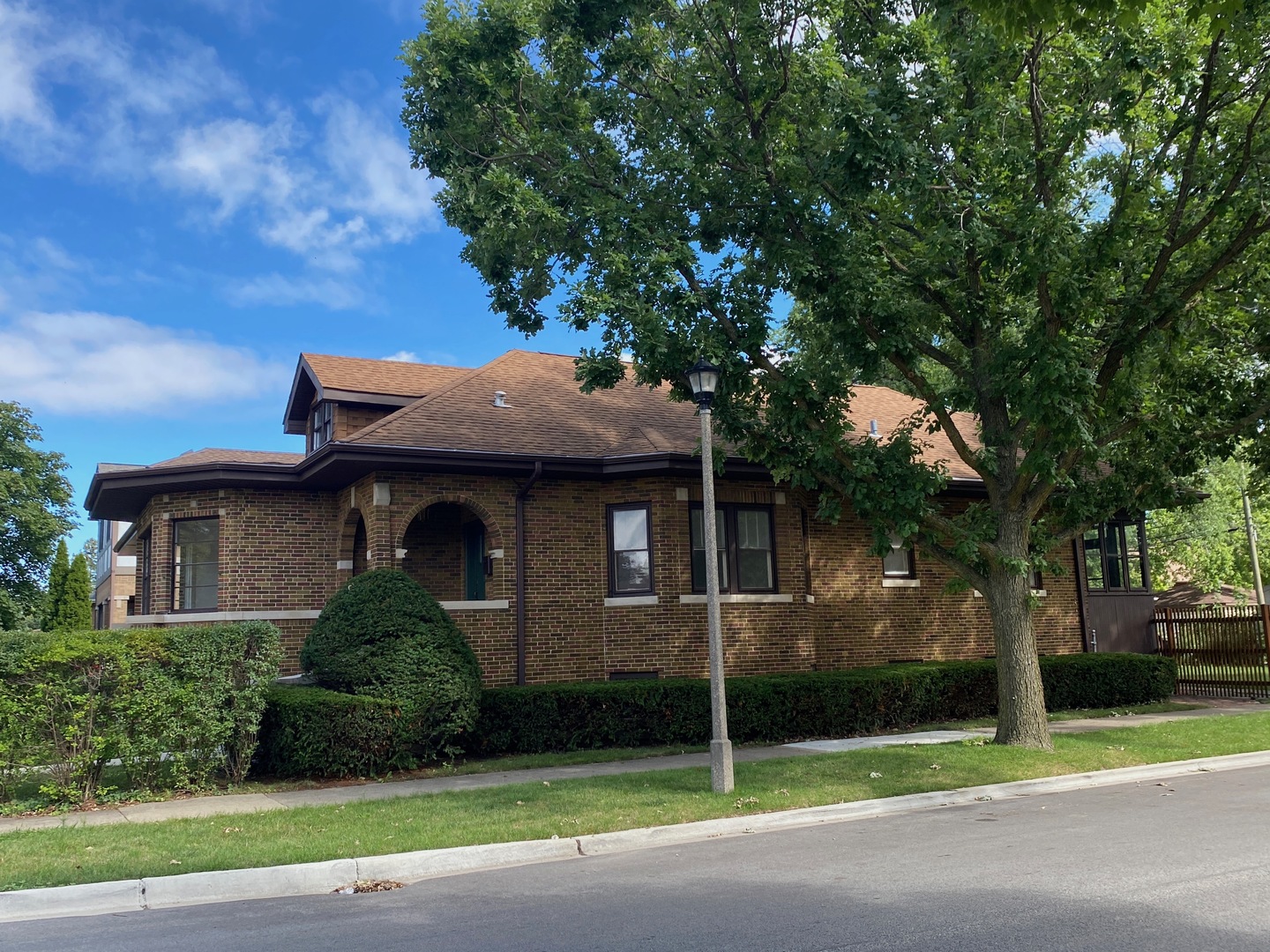 5253 Cleveland Street Skokie, IL 60077 - Photo 4 of 57 a front view of a house with garden