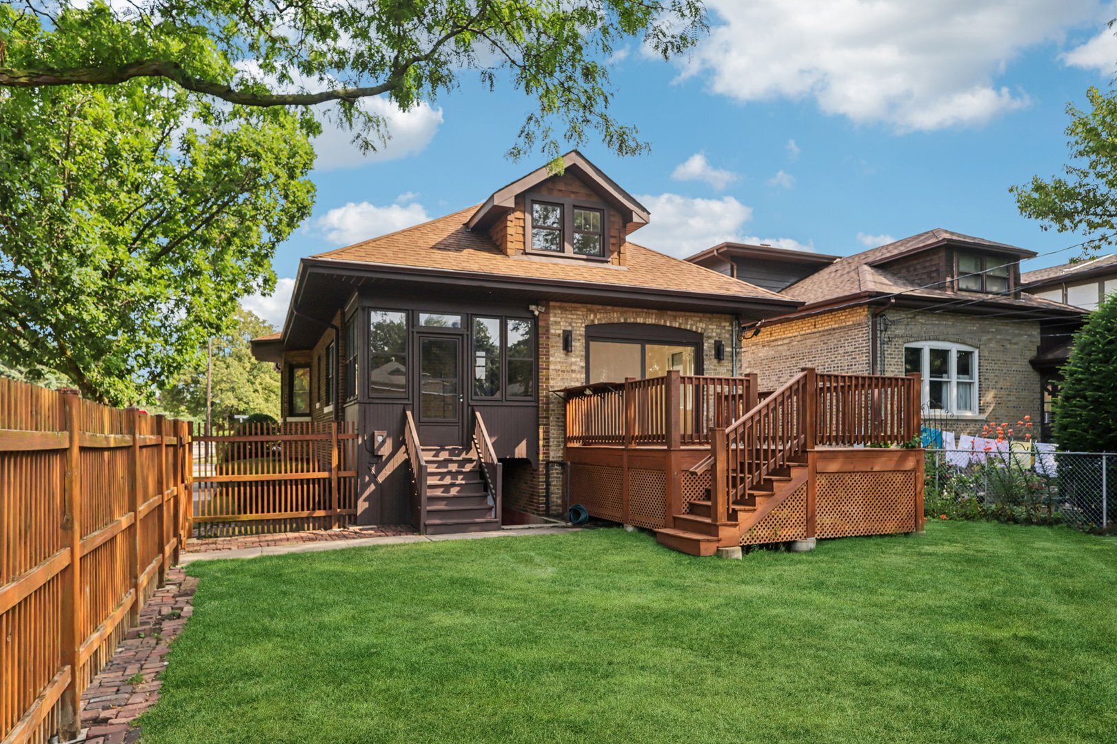 5253 Cleveland Street Skokie, IL 60077 - Photo 49 of 57 a view of a house with a yard and sitting area