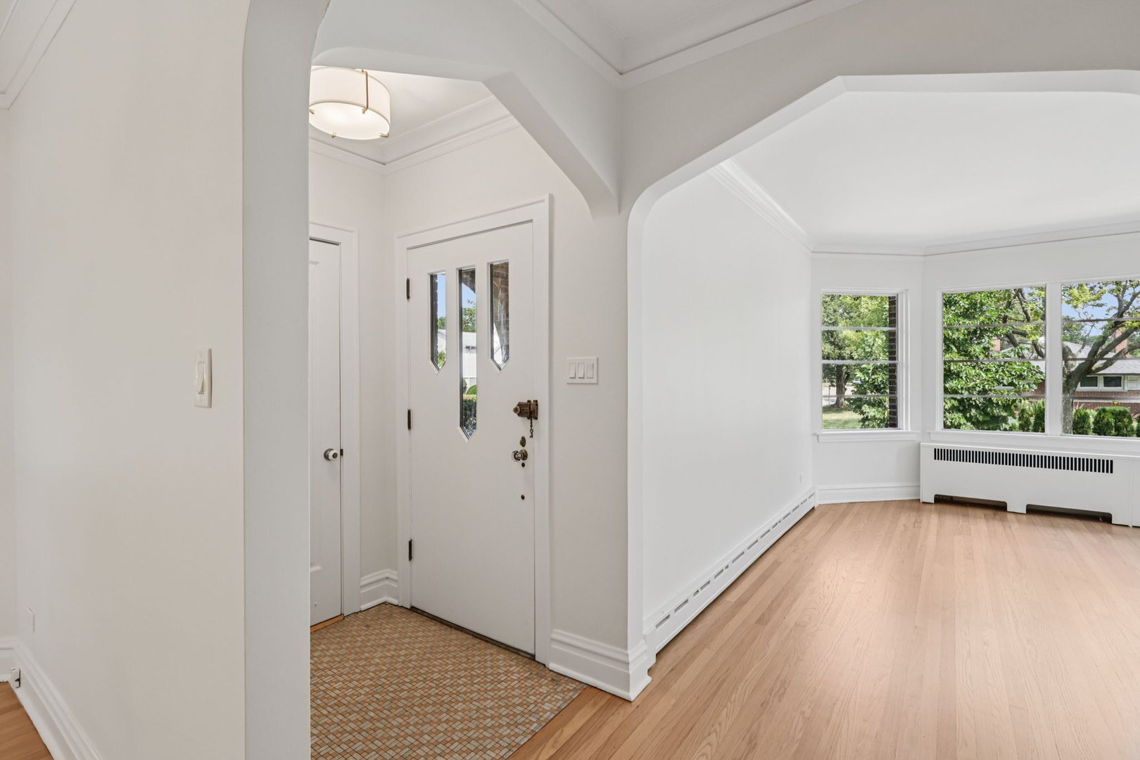 5253 Cleveland Street Skokie, IL 60077 - Photo 5 of 57 a view of livingroom with furniture window and wooden floor